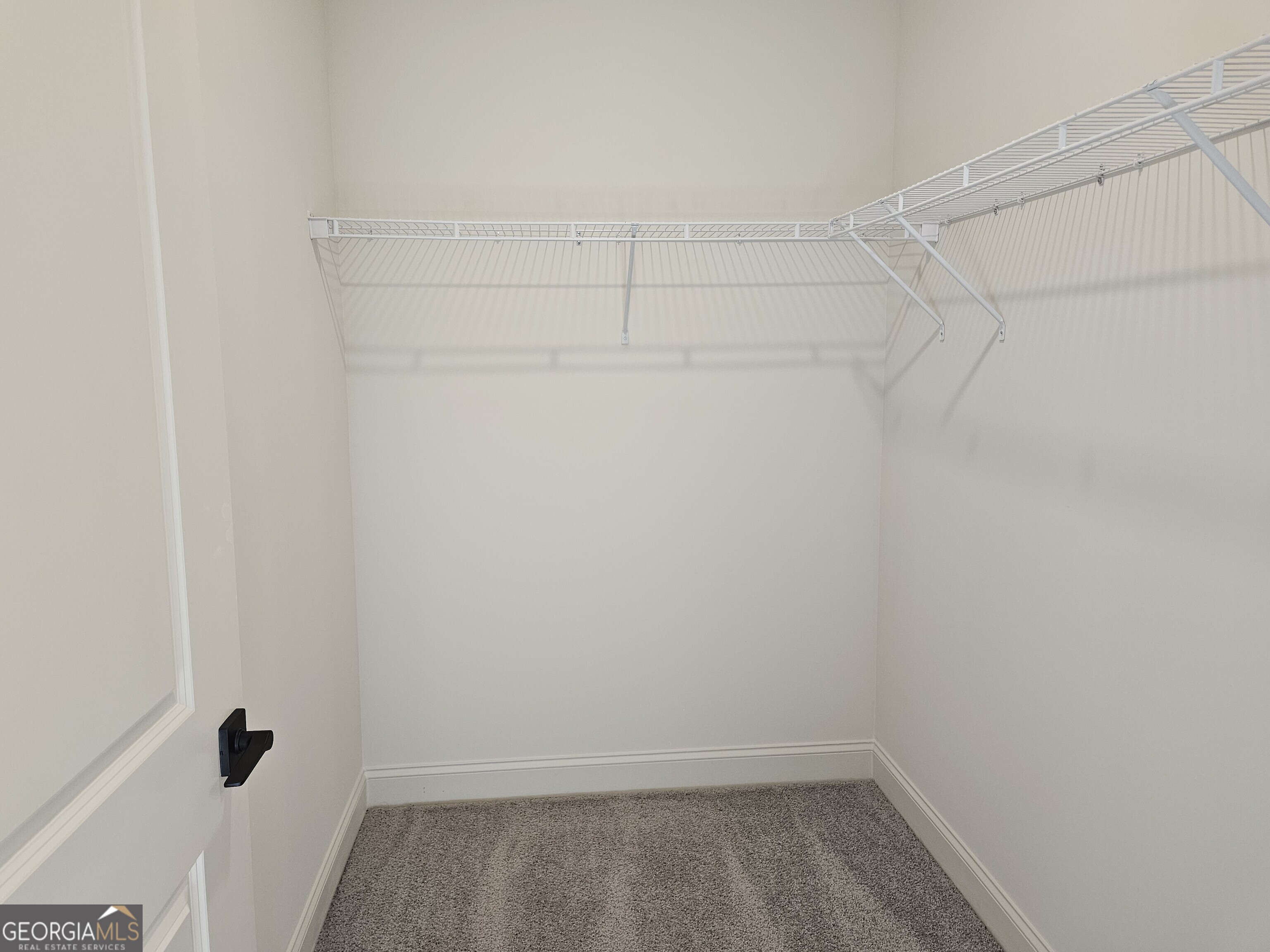 208 Trellis Walk Macon, GA 31220 - Photo 24 of 30 a view of a room with racks on the wall