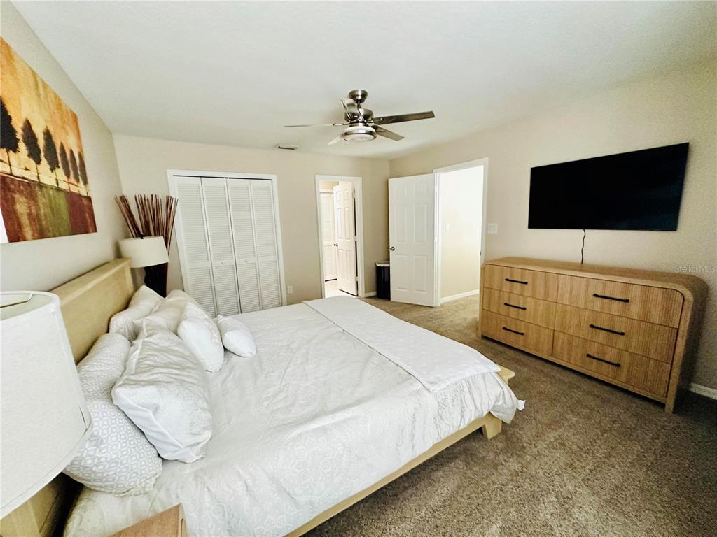 784 South Pennsylvania Avenue Winter Park, FL 32789 - Photo 26 of 29 a bedroom with a bed and a flat screen tv
