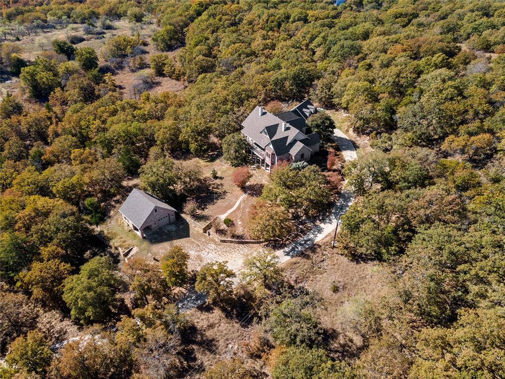 396 Ranchview Court Bowie, TX 76230 - Photo 28 of 38 a view of a forest with a house
