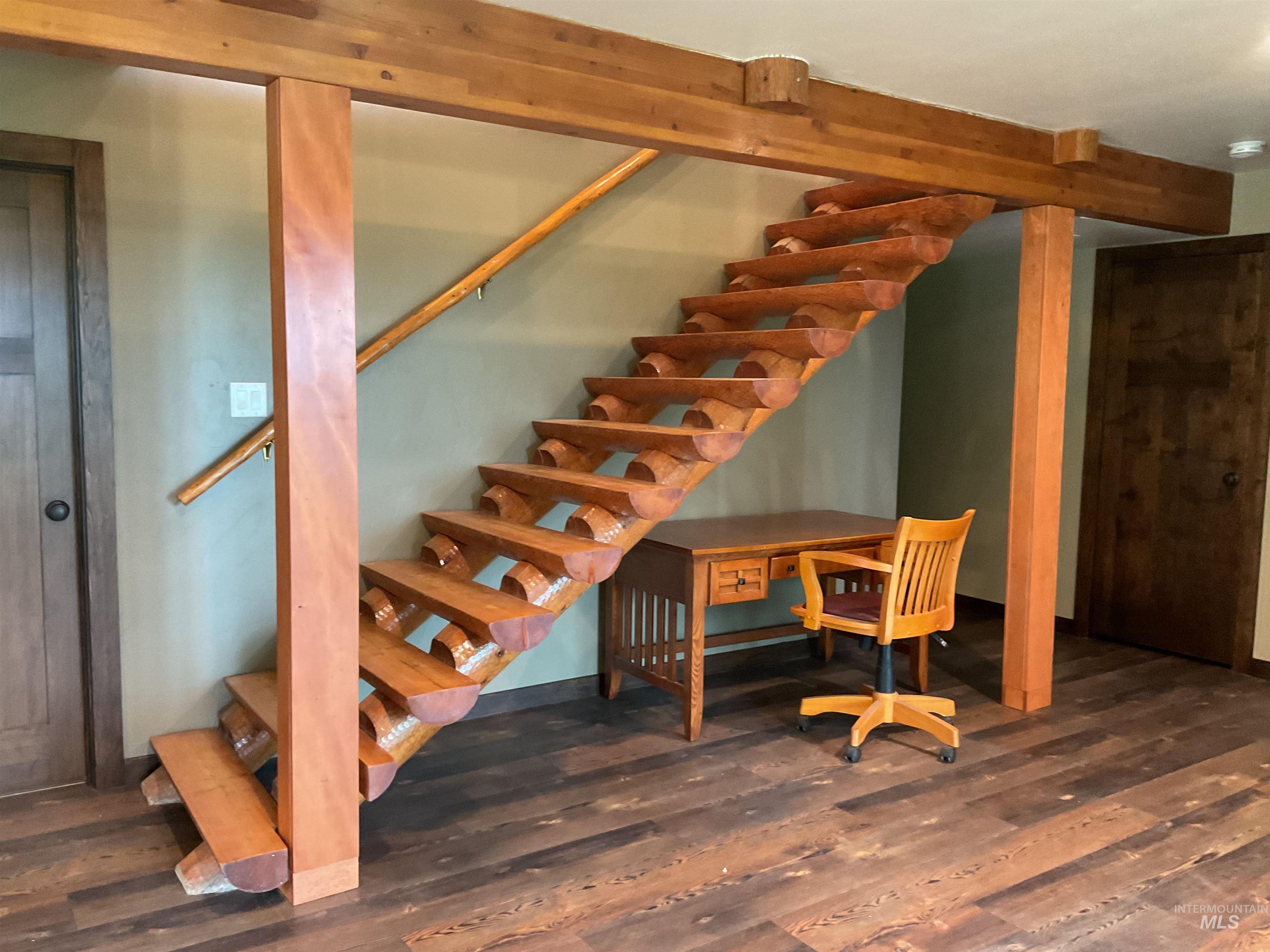 6125 Freeman Creek Road Lenore, ID 83541 - Photo 29 of 44 Crafted wooden staircase with log-style treads and a wooden handrail