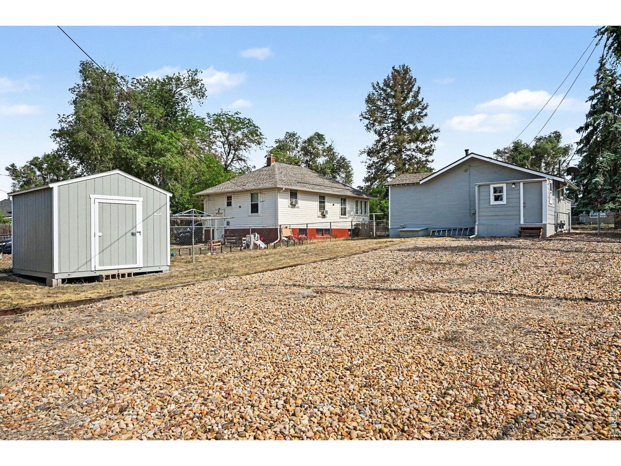 427 9th Street Greeley, CO 80631 - Photo 19 of 22 a front view of a house with a yard