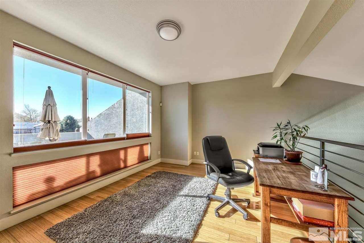 334 State Street Reno, NV 89501 - Photo 13 of 17 a living room with furniture and a floor to ceiling window