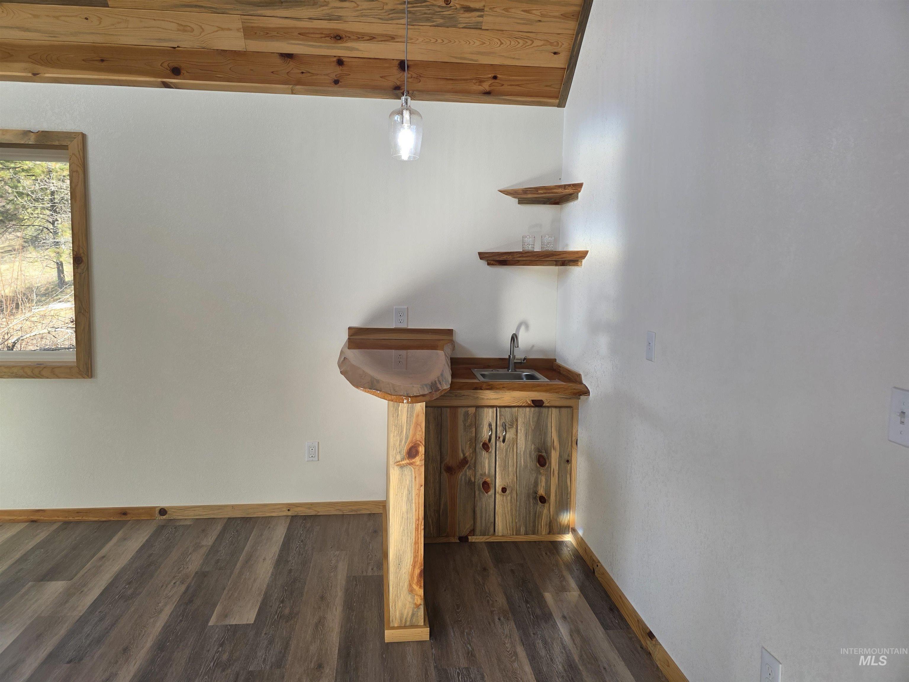 4157 Highway 12 Kamiah, ID 83536 - Photo 19 of 40 Stairway featuring wood finished floors and wet bar