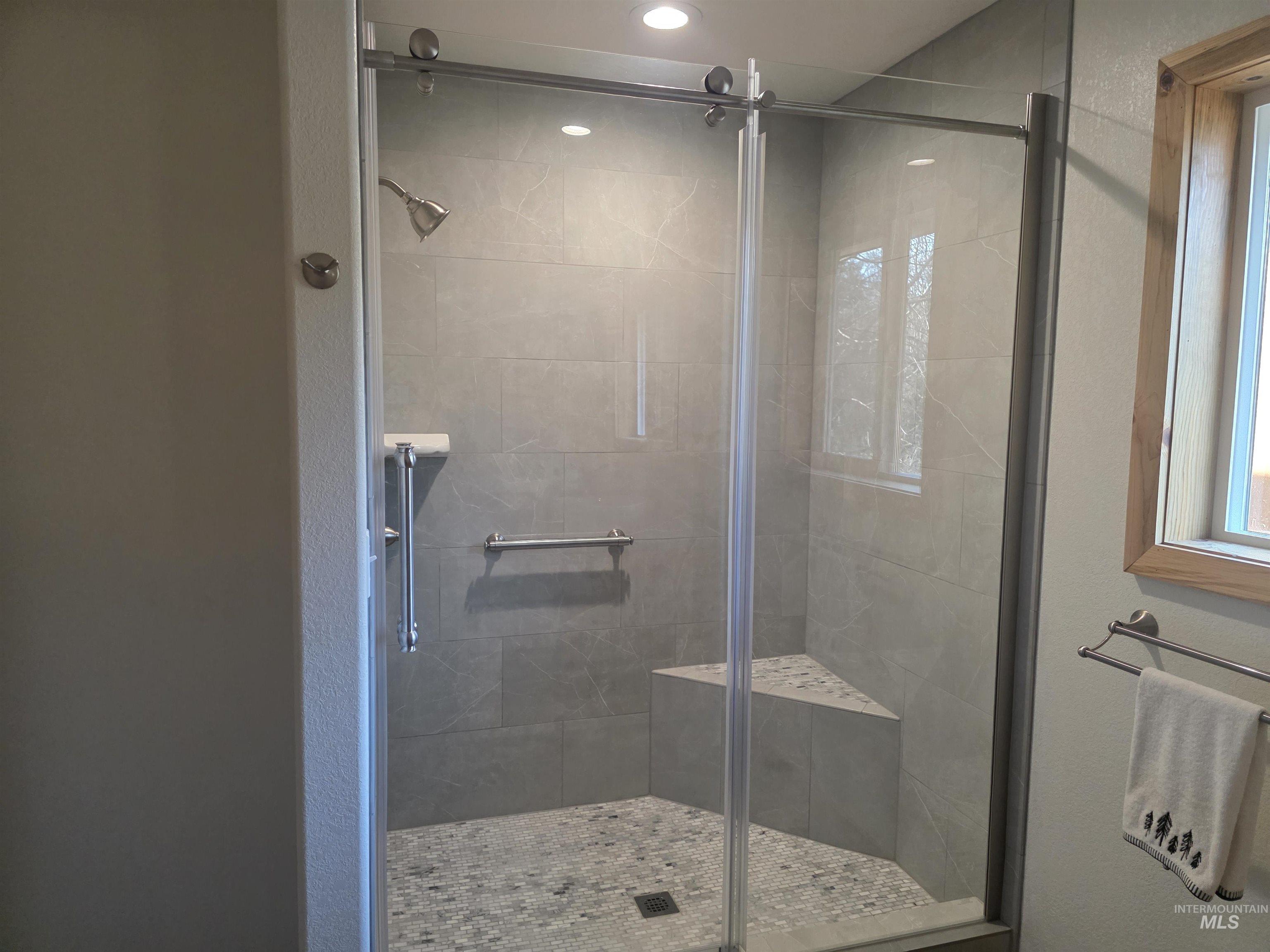 4157 Highway 12 Kamiah, ID 83536 - Photo 24 of 40 Full bathroom with a shower stall and a textured wall
