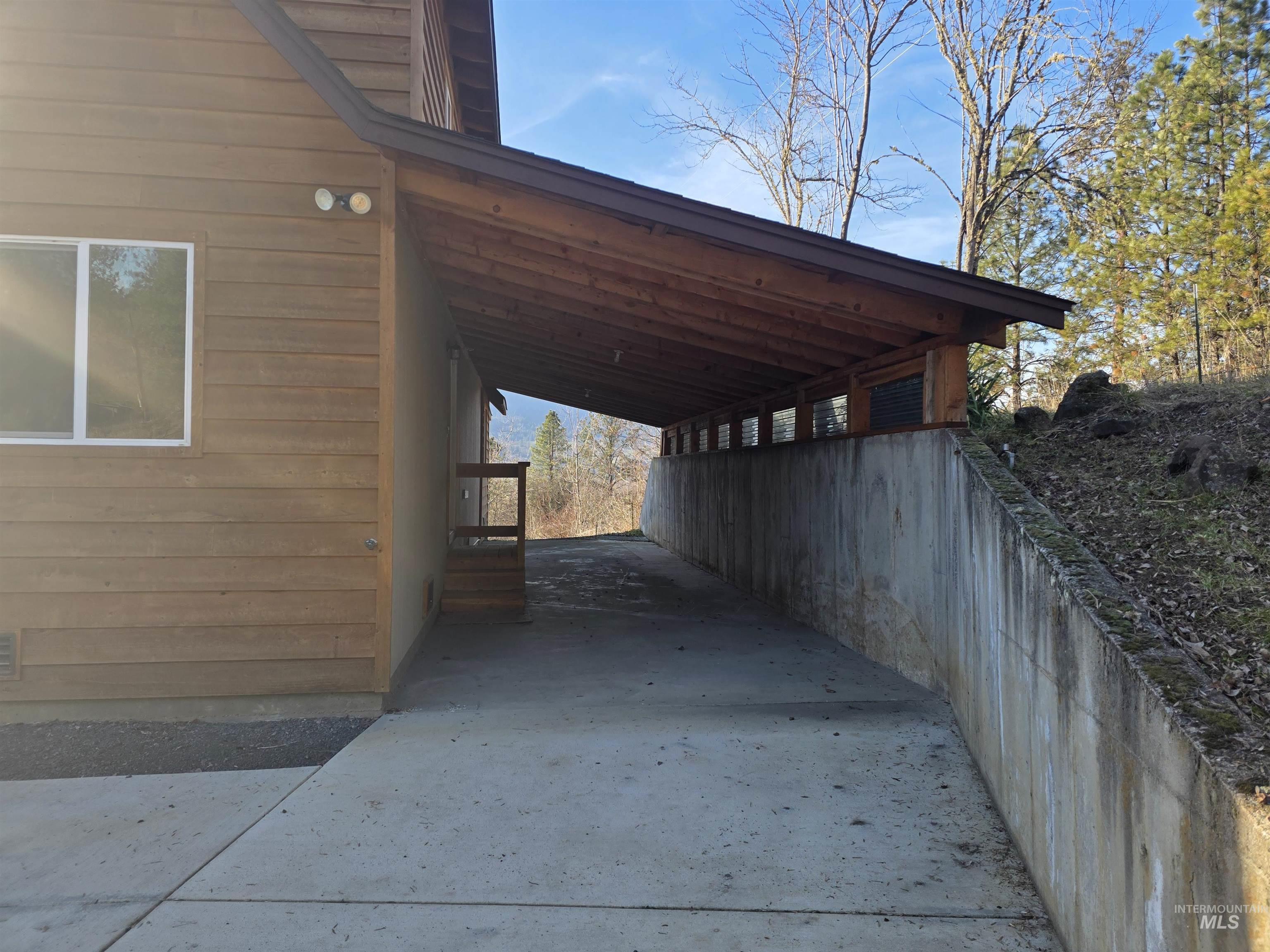 4157 Highway 12 Kamiah, ID 83536 - Photo 3 of 40 View of parking featuring driveway and an attached carport