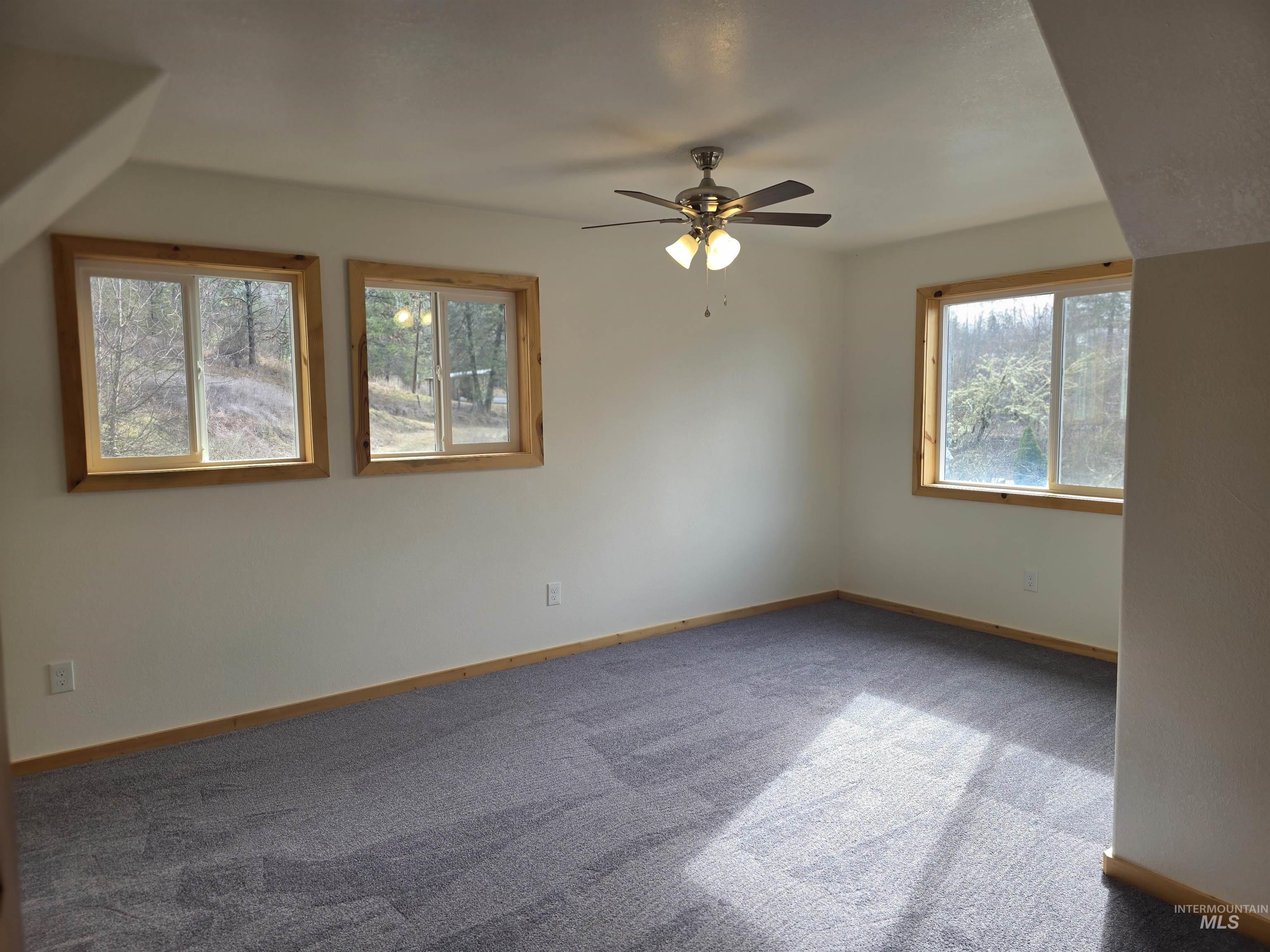 4157 Highway 12 Kamiah, ID 83536 - Photo 33 of 40 Carpeted spare room featuring ceiling fan and baseboards