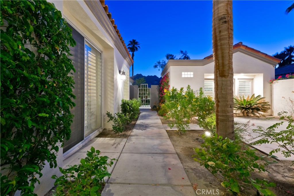 56980 Merion La Quinta, CA 92253 - Photo 16 of 51 a view of a pathway with house on both side