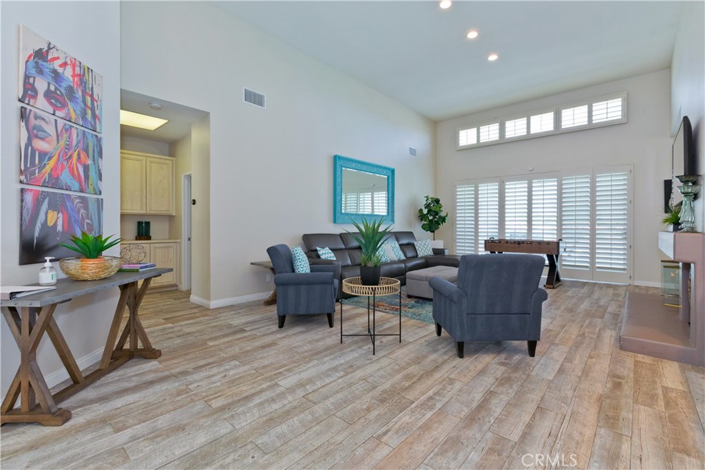 56980 Merion La Quinta, CA 92253 - Photo 17 of 51 a living room with furniture and a wooden floor