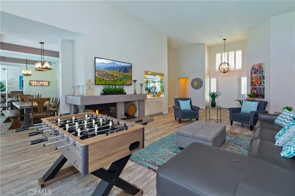 a living room with furniture a rug and a painting on the wall