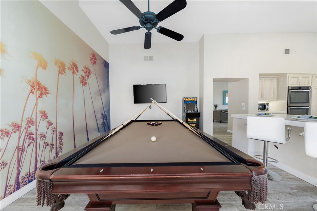 56980 Merion La Quinta, CA 92253 - Photo 21 of 51 a living room with furniture and kitchen view