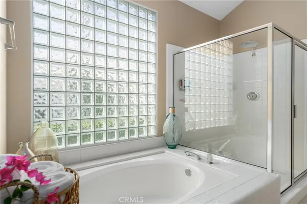 a bathroom with a bathtub and shower