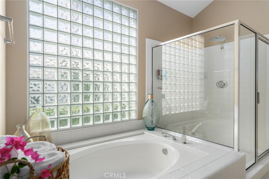 56980 Merion La Quinta, CA 92253 - Photo 30 of 51 a bathroom with a bathtub and shower