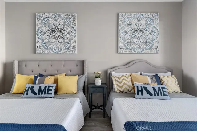 a bedroom with bed and cupboard