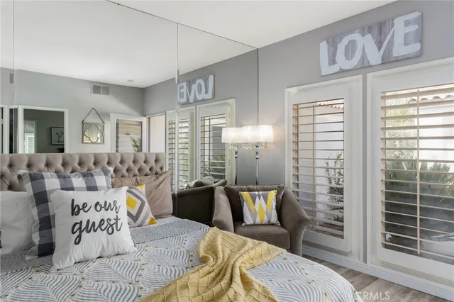 a view of a livingroom with furniture and wooden floor