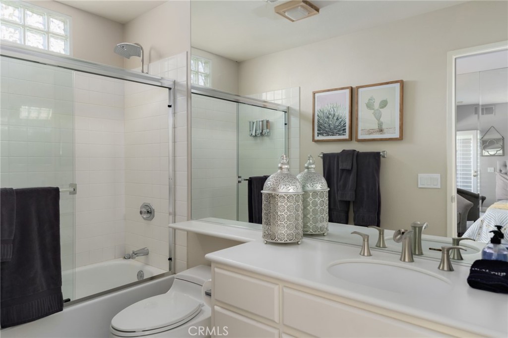 56980 Merion La Quinta, CA 92253 - Photo 39 of 51 a bathroom with a granite countertop sink toilet and shower