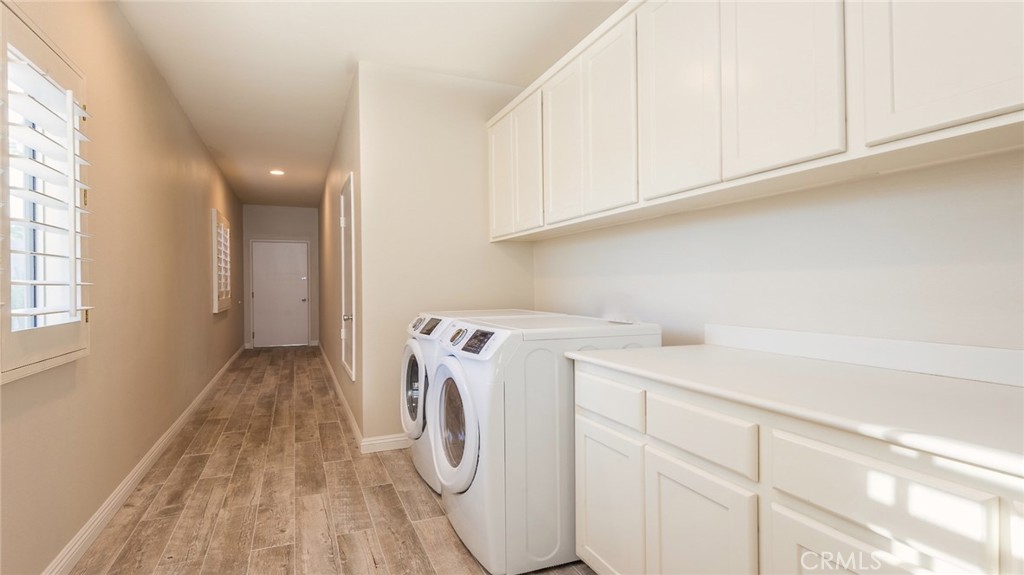 56980 Merion La Quinta, CA 92253 - Photo 44 of 51 a utility room with dryer and washer