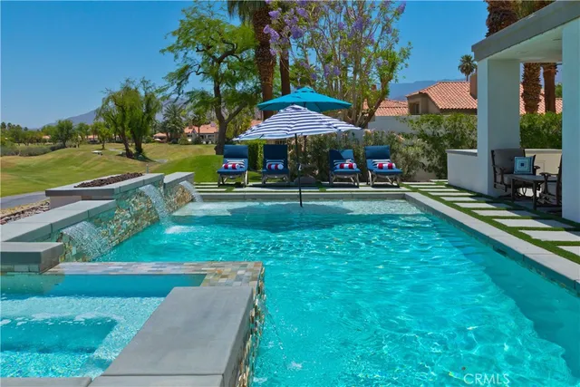 a living room filled with furniture and a fireplace