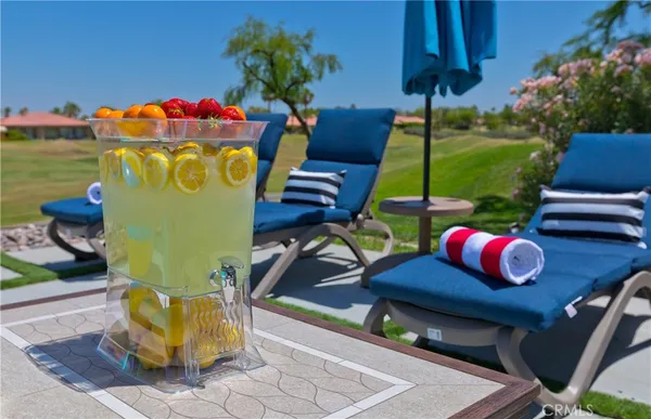 a view of a chairs and table in patio