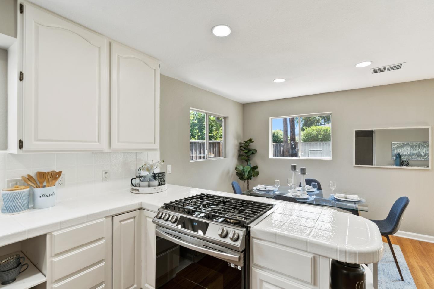 762 Armanini Avenue Santa Clara, CA 95050 - Photo 14 of 43 a kitchen with stainless steel appliances granite countertop a stove a sink and a refrigerator