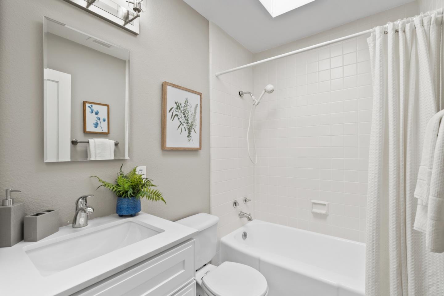 762 Armanini Avenue Santa Clara, CA 95050 - Photo 21 of 43 a bath room with a toilet a sink and a bath tub