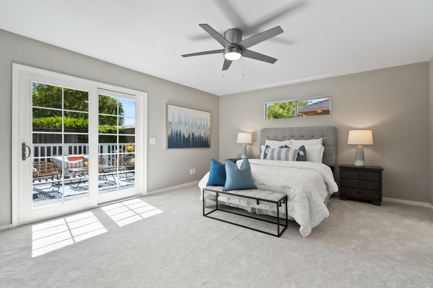 762 Armanini Avenue Santa Clara, CA 95050 - Photo 22 of 43 a spacious bedroom with a bed a couch and a large window