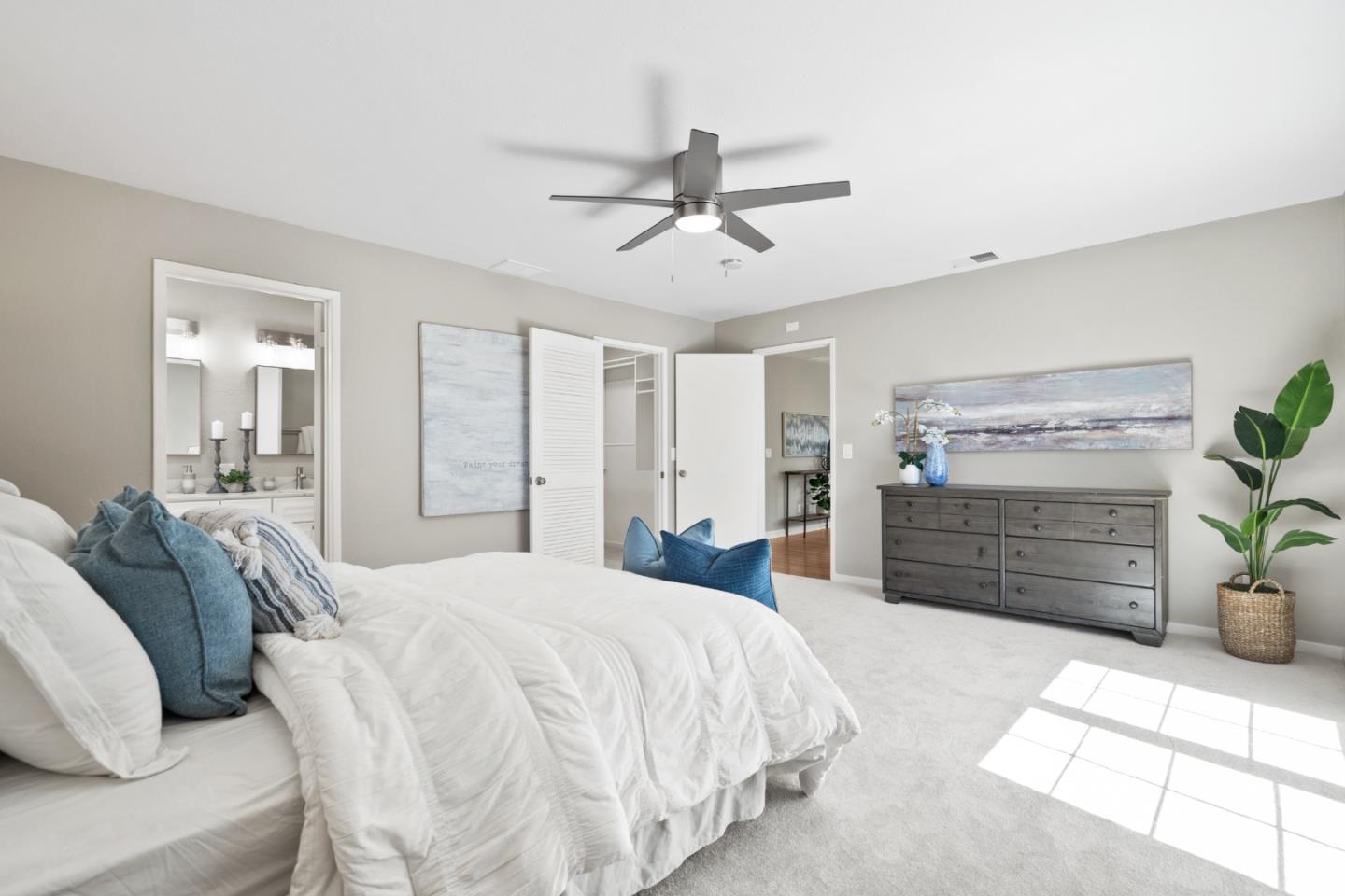 762 Armanini Avenue Santa Clara, CA 95050 - Photo 23 of 43 a spacious bedroom with a bed a dresser and a couch