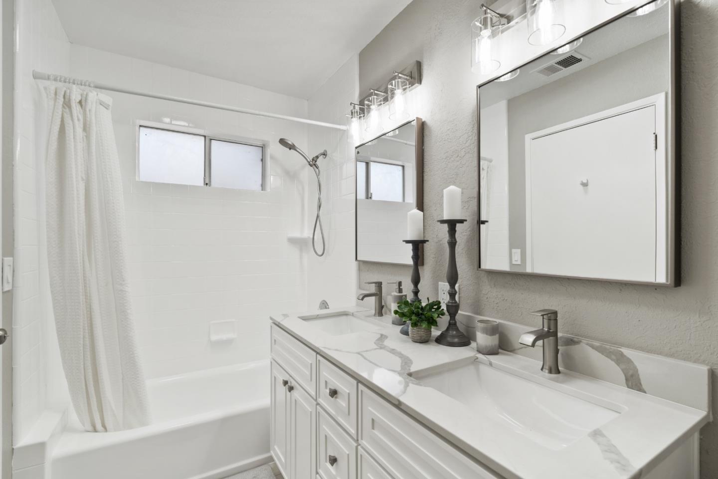 762 Armanini Avenue Santa Clara, CA 95050 - Photo 25 of 43 a bathroom with a bathtub a sink a vanity and a mirror