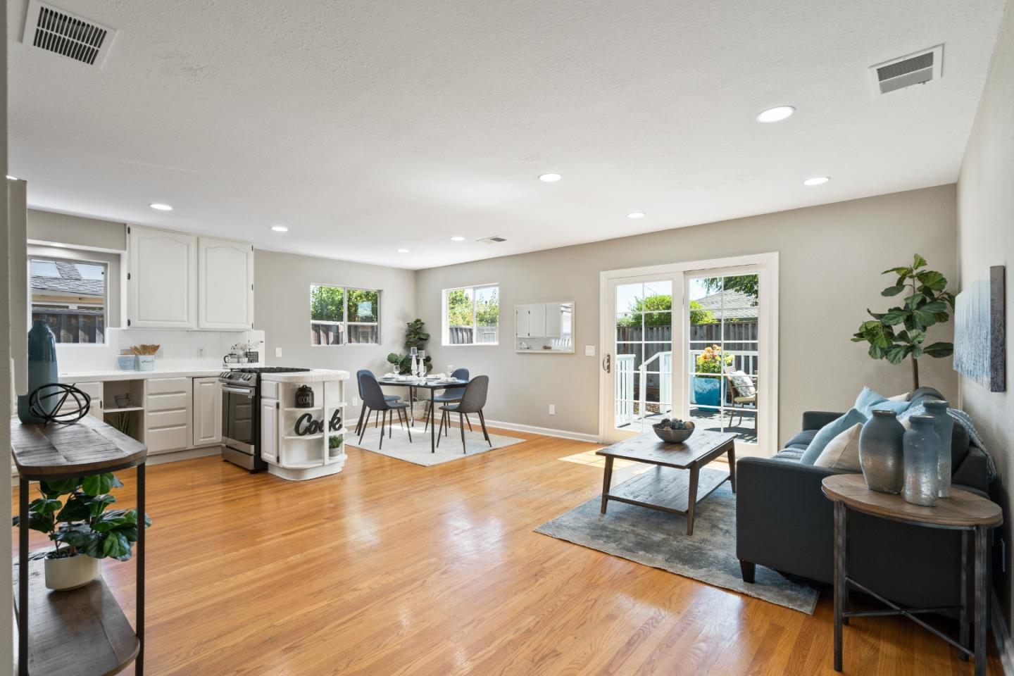 762 Armanini Avenue Santa Clara, CA 95050 - Photo 7 of 43 a living room with furniture dining table and a large window