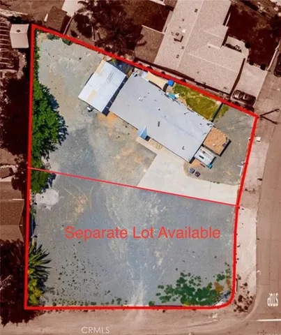 an aerial view of a houses with yard