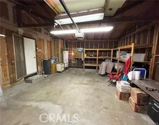 a kitchen with a refrigerator and a stove top oven