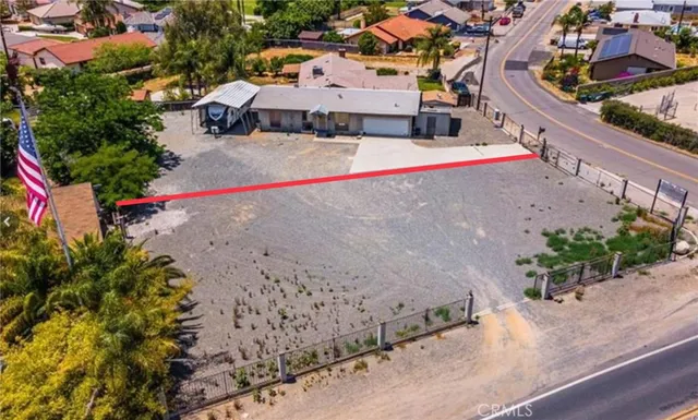 an aerial view of a house with a swimming pool yard and mountain view in back