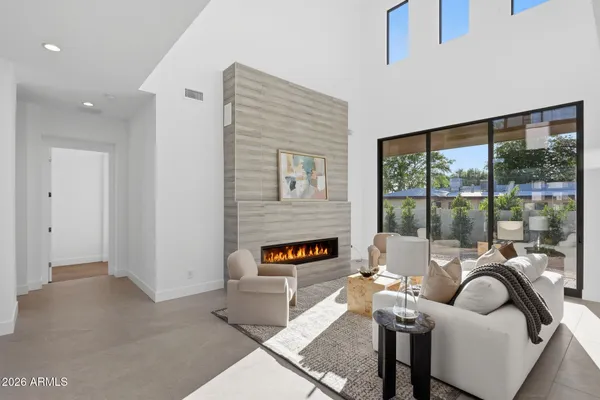 a living room with furniture and a large window