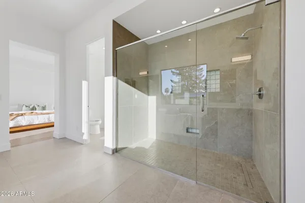 a bathroom with a shower and a sink