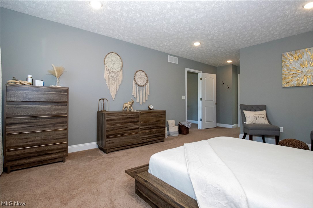 4750 McCauley Road Wooster, OH 44691 - Photo 26 of 37 Carpeted bedroom featuring a textured ceiling