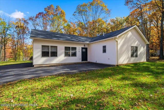 a view of a house with a yard