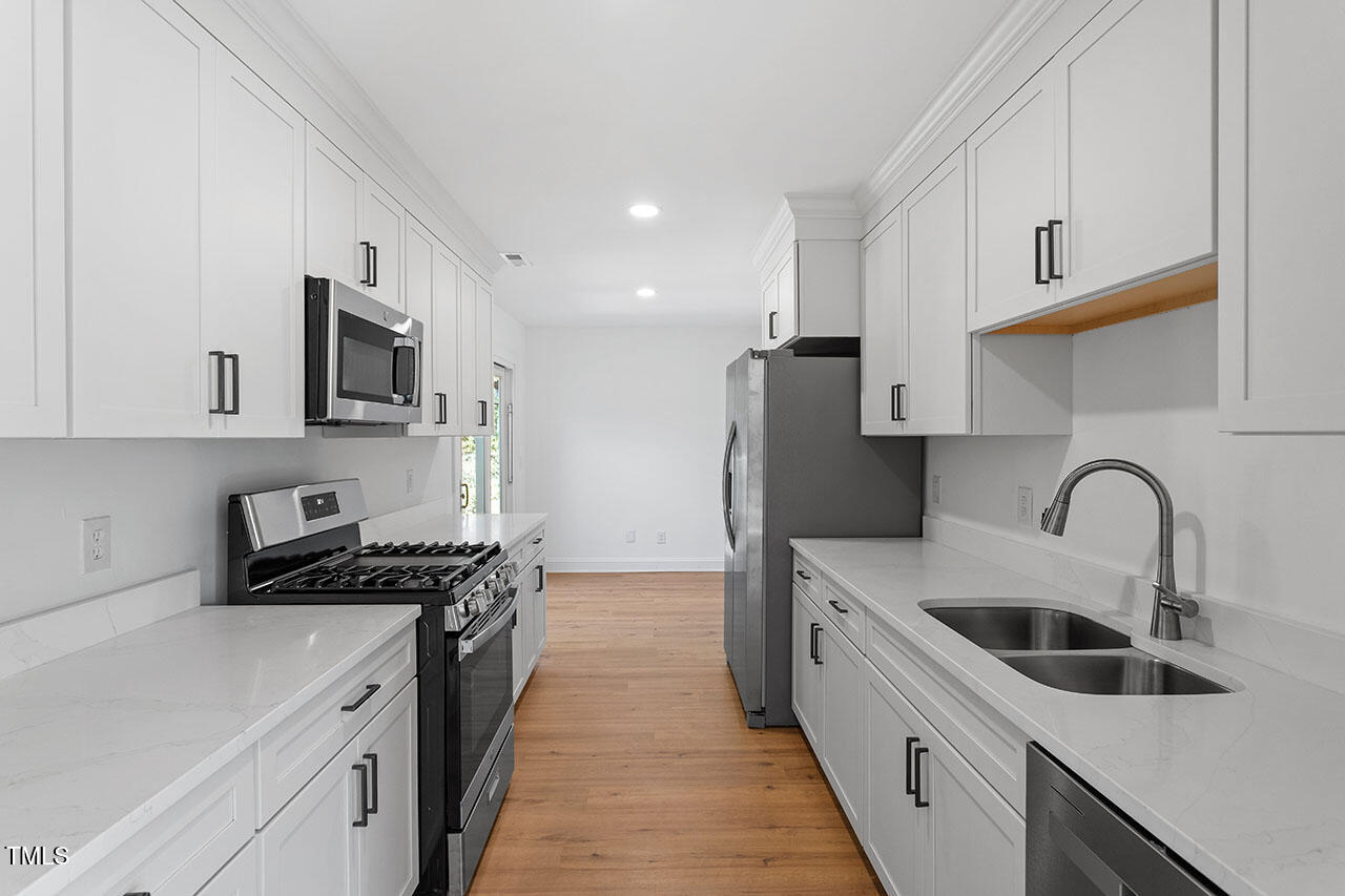 1402 Buckhorn Road Garner, NC 27529 - Photo 8 of 24 Kitchen w/New Stainless Steel Appliances Including Refrigerator