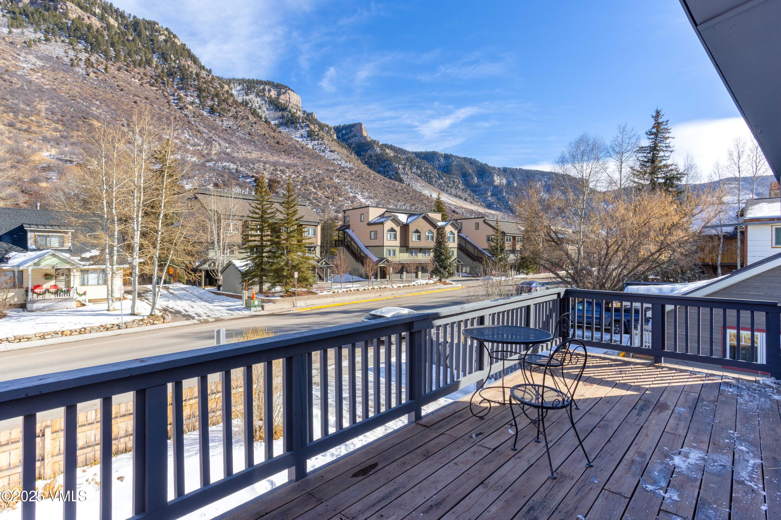 561 Main Street Minturn, CO 81645 - Photo 14 of 29 a view of a balcony with two chairs and wooden floor