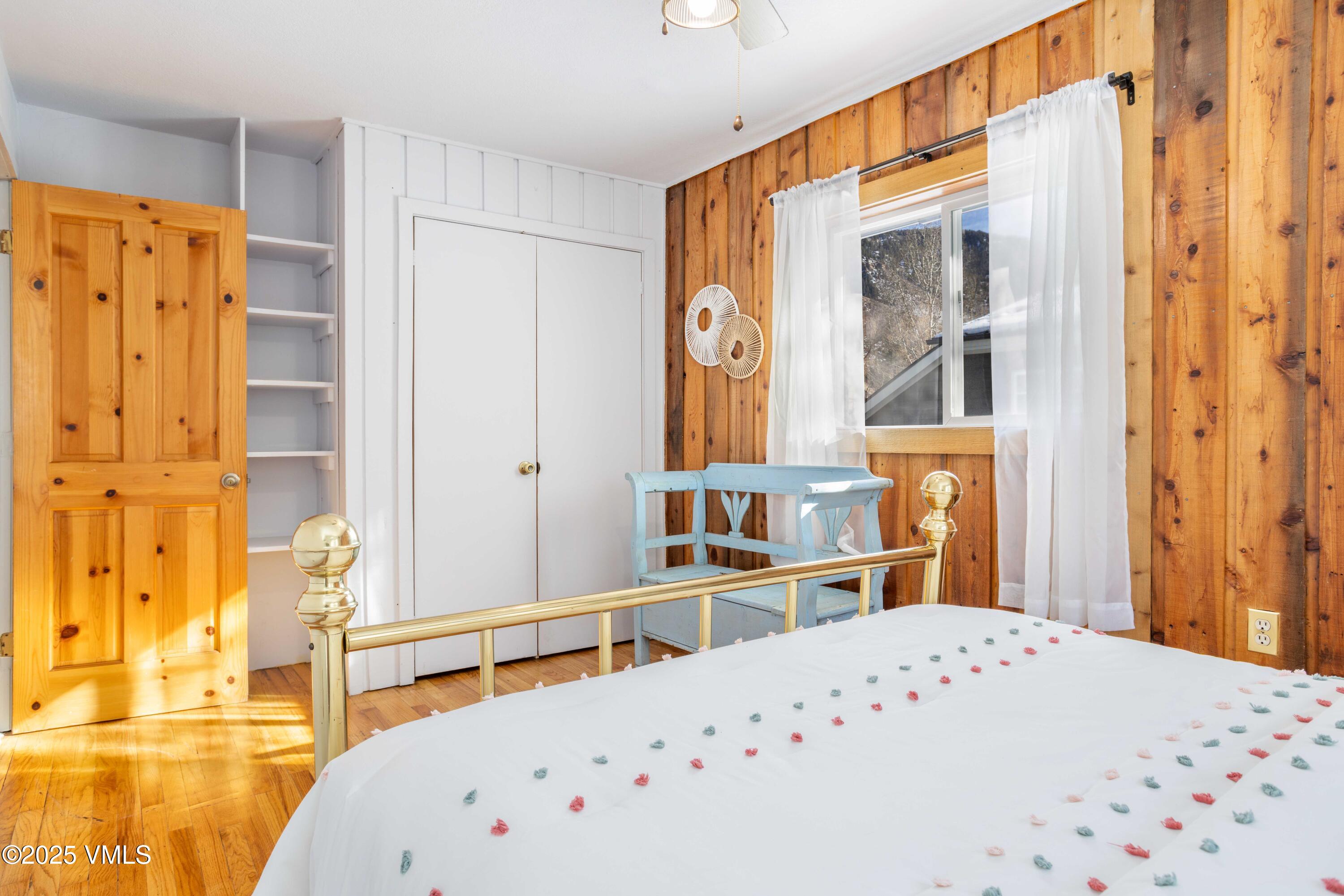 561 Main Street Minturn, CO 81645 - Photo 16 of 29 a bedroom with a bed and a large window