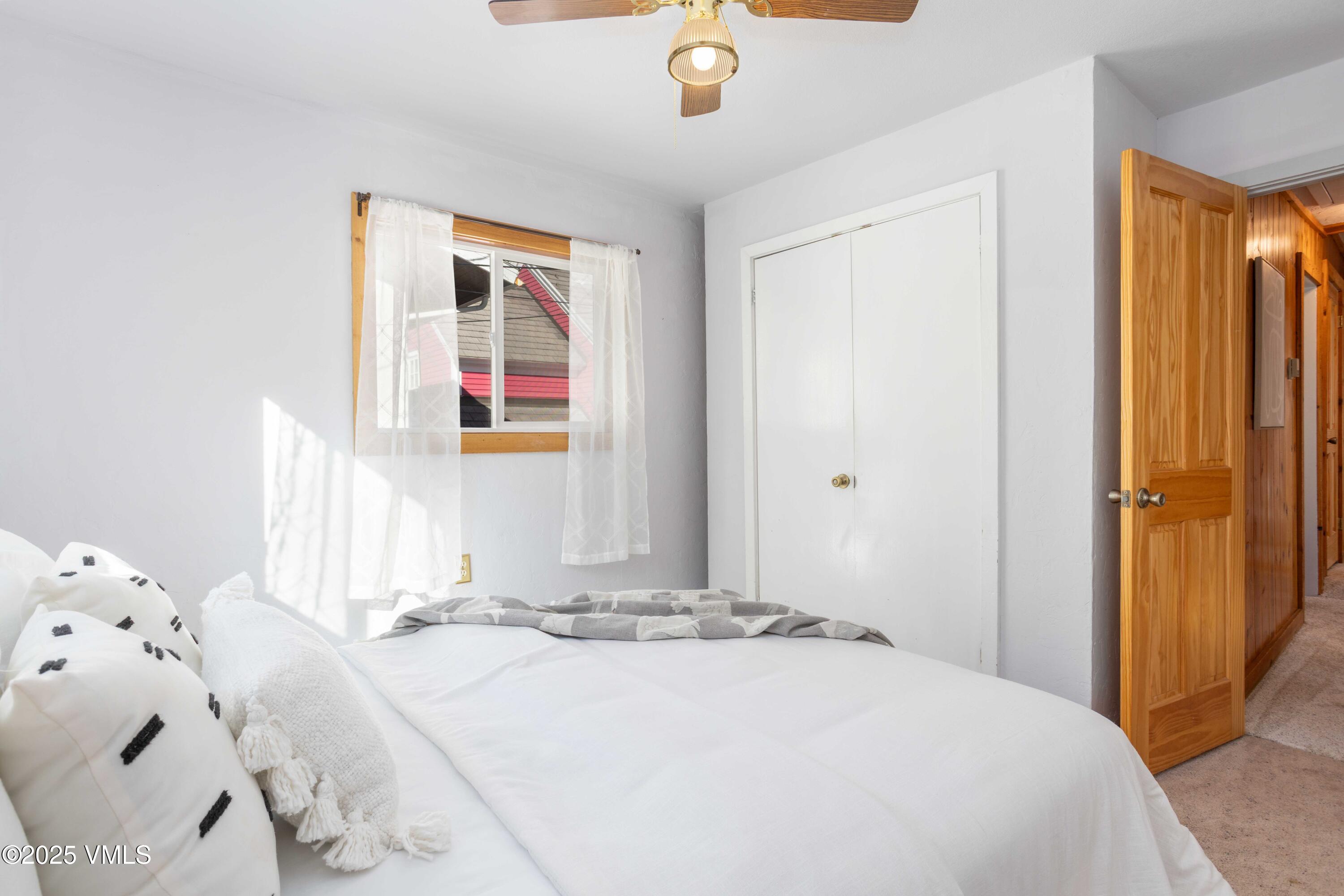 561 Main Street Minturn, CO 81645 - Photo 18 of 29 a bedroom with a bed and a window