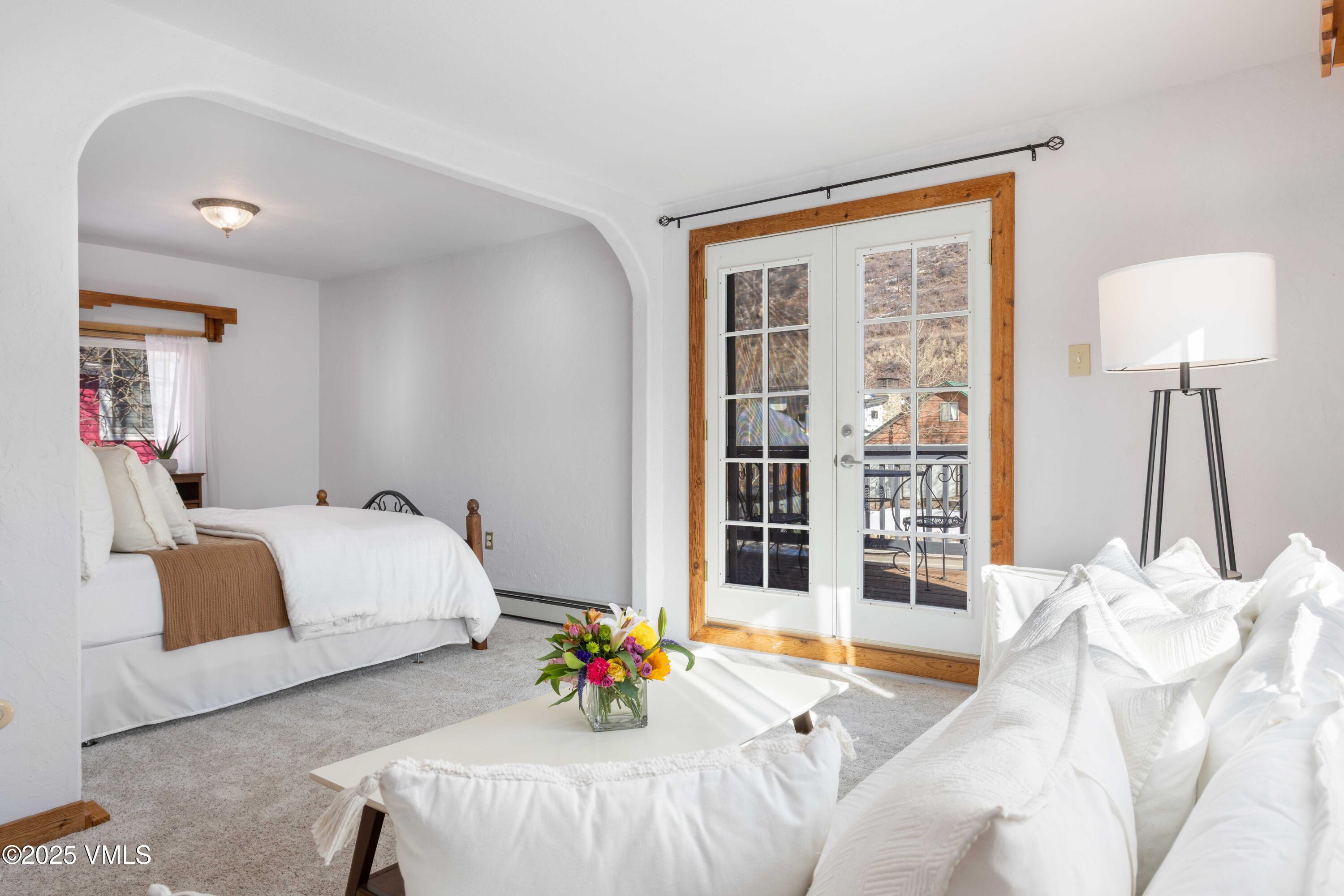 561 Main Street Minturn, CO 81645 - Photo 2 of 29 a bedroom with a bed and a window