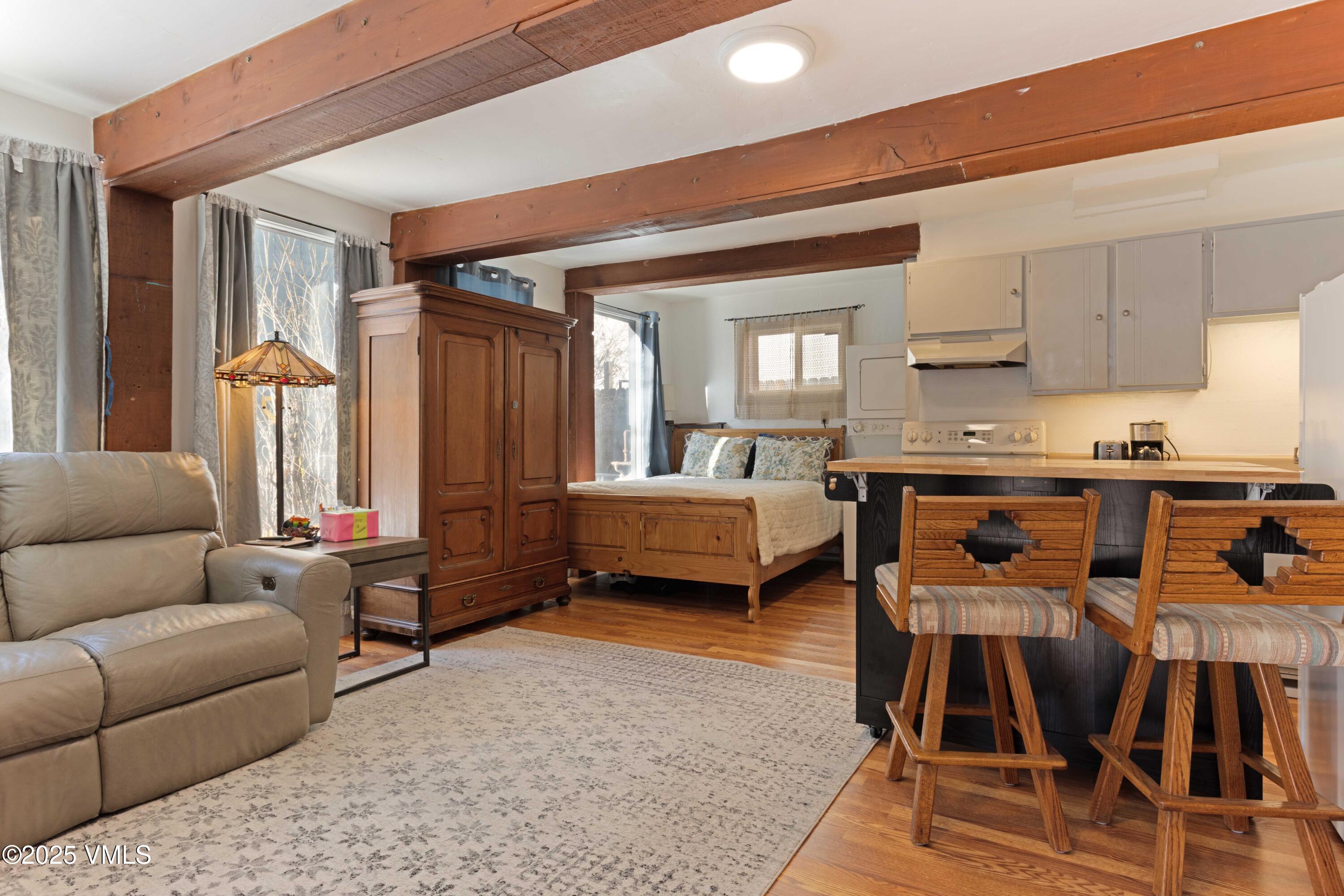 561 Main Street Minturn, CO 81645 - Photo 22 of 29 a living room with furniture and a dining table with kitchen view