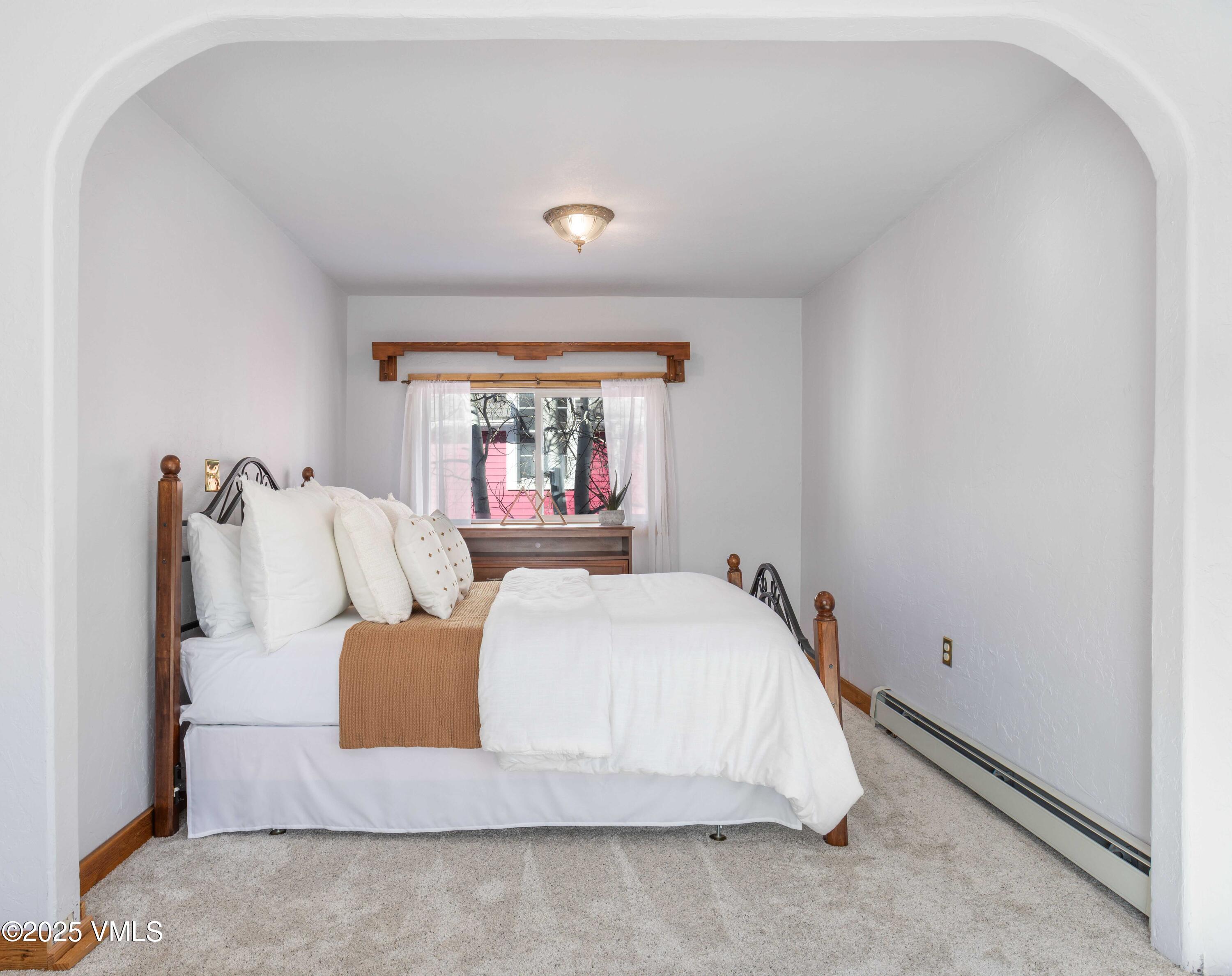 561 Main Street Minturn, CO 81645 - Photo 9 of 29 a bed sitting in a bedroom next to a window