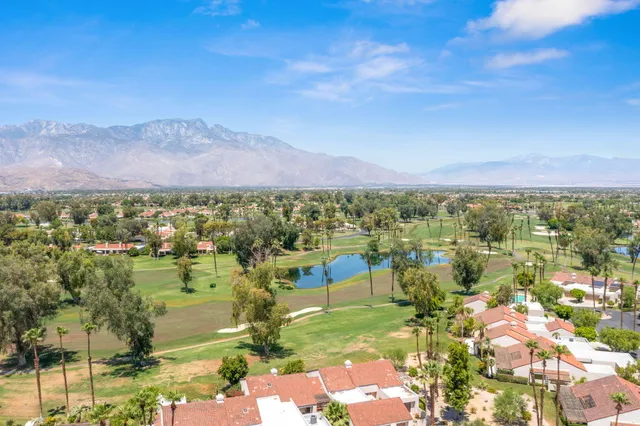 a view of a city with mountains in the background