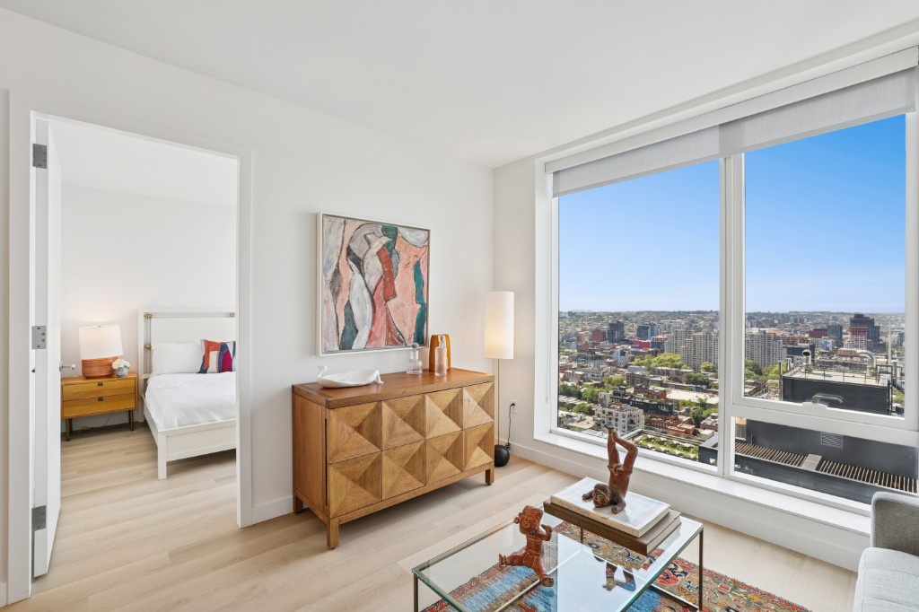 17 Hanover Place, Unit 25E Brooklyn, NY 11217 - Photo 1 of 8 a living room with furniture and a floor to ceiling window