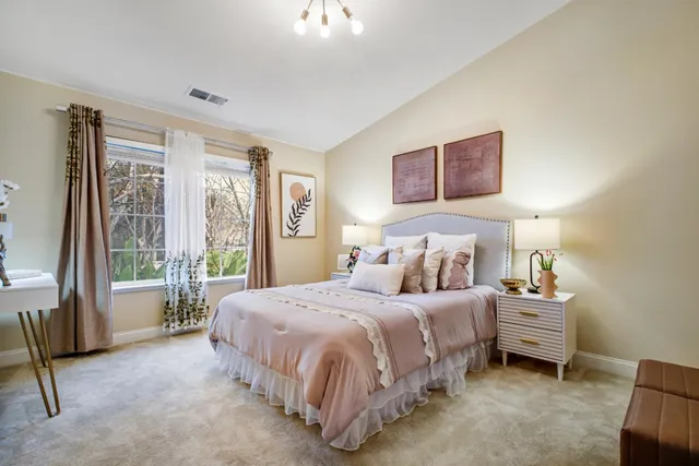 a bedroom with a bed and a couch