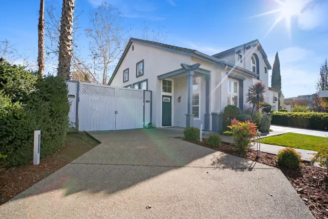 a view of a house with a yard and garage