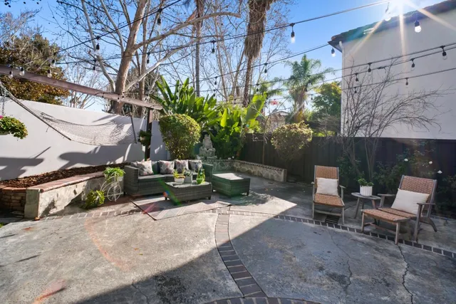 a view of a backyard with sitting area and furniture