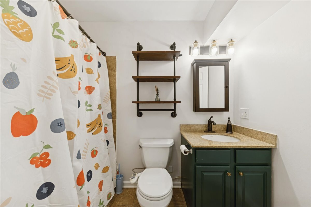 648 North Bishop Street, Unit S Chicago, IL 60642 - Photo 11 of 23 a bathroom with a sink and a mirror with toilet
