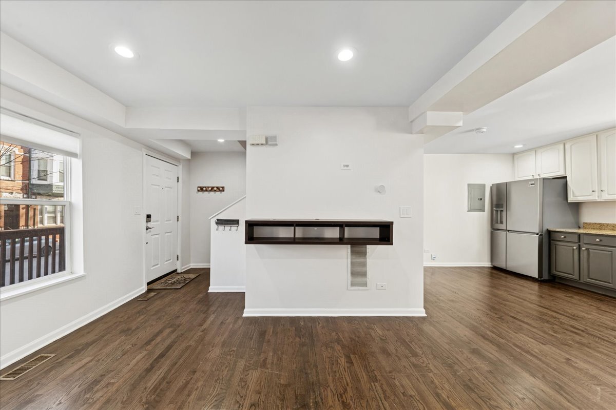 648 North Bishop Street, Unit S Chicago, IL 60642 - Photo 3 of 23 a kitchen with stainless steel appliances a refrigerator and a stove top oven