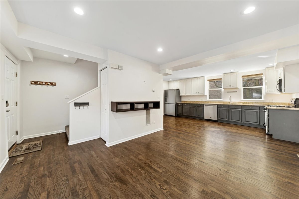 648 North Bishop Street, Unit S Chicago, IL 60642 - Photo 5 of 23 a view of a kitchen with wooden floor and electronic appliances